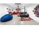 Spacious home theater boasts a large screen, comfortable seating, and themed decor for immersive entertainment at 12736 Lake Ridge Cir, Clermont, FL 34711