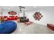 Bright home theatre with projector, comfortable seating, movie posters, and themed accents for the ultimate viewing experience at 12736 Lake Ridge Cir, Clermont, FL 34711