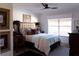 This bedroom features neutral colors, ample natural light, and a ceiling fan at 12841 Se 97Th Terrace Rd, Summerfield, FL 34491