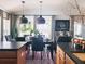 Bright dining area showcases elegant lighting fixtures and seamless integration with the kitchen space at 12841 Se 97Th Terrace Rd, Summerfield, FL 34491