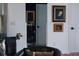 Interior hallway with art, greyhound statue, and elegant door hardware at 12841 Se 97Th Terrace Rd, Summerfield, FL 34491