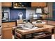 Kitchen island with open cookbook on display and decor at 12841 Se 97Th Terrace Rd, Summerfield, FL 34491