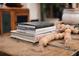 Living room decor featuring Ralph Lauren coffee table books and wood bead garland at 12841 Se 97Th Terrace Rd, Summerfield, FL 34491