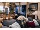 Cozy living room with comfortable couch and dog relaxing on the pillows at 12841 Se 97Th Terrace Rd, Summerfield, FL 34491