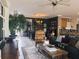 Spacious living room with dark green walls, plush seating, and elegant decor at 12841 Se 97Th Terrace Rd, Summerfield, FL 34491