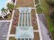 Aerial view of a shuffleboard court surrounded by palm trees at 12841 Se 97Th Terrace Rd, Summerfield, FL 34491