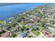 An aerial view of a charming home nestled in a quiet residential neighborhood with water access at 13 Sandcastle Dr, Ormond Beach, FL 32176