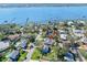 An aerial view of a charming home nestled in a quiet residential neighborhood with water access at 13 Sandcastle Dr, Ormond Beach, FL 32176