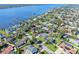 An aerial view of a charming home nestled in a quiet residential neighborhood with water access at 13 Sandcastle Dr, Ormond Beach, FL 32176