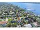 An aerial view of a charming home nestled in a quiet residential neighborhood with water access and community docks at 13 Sandcastle Dr, Ormond Beach, FL 32176
