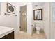 Clean bathroom with a glass-enclosed shower and a toilet at 13 Sandcastle Dr, Ormond Beach, FL 32176