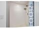 Shower with white tile and a glass door, featuring modern fixtures and clean design at 13 Sandcastle Dr, Ormond Beach, FL 32176