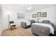 Bright bedroom featuring two twin beds, neutral carpet, and a full-sized window at 13 Sandcastle Dr, Ormond Beach, FL 32176