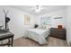 Cozy bedroom featuring neutral tones, a ceiling fan, and a double bed with plush pillows at 13 Sandcastle Dr, Ormond Beach, FL 32176