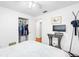 Bright bedroom featuring a closet, a television, and a comfortable bed with patterned bedspread at 13 Sandcastle Dr, Ormond Beach, FL 32176