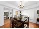 This dining room features hardwood floors, a square table with seating for six, and recessed lighting at 13 Sandcastle Dr, Ormond Beach, FL 32176