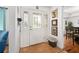Inviting foyer with decorative glass door, tiled floor, and access to dining room at 13 Sandcastle Dr, Ormond Beach, FL 32176