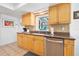 Kitchen featuring granite countertops, stainless steel appliances, and custom cabinets at 13 Sandcastle Dr, Ormond Beach, FL 32176
