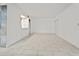 Open living room featuring tiled floors, lots of natural light and seamless flow into the kitchen at 140 Orchid Woods Ct # 7A, Deltona, FL 32725