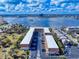 Aerial view of condo buildings with a cityscape backdrop highlights proximity to water and local amenities at 144 S Halifax Ave # 86, Daytona Beach, FL 32118