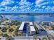 Aerial view of condo buildings with a cityscape backdrop highlights proximity to water and local amenities at 144 S Halifax Ave # 86, Daytona Beach, FL 32118