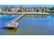 Elevated view featuring a dock and lawn area in front of a waterfront condo building near a river at 144 S Halifax Ave # 86, Daytona Beach, FL 32118