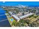 Beautiful aerial view of apartments and condos overlooking the water, featuring a refreshing pool and lush landscaping at 144 S Halifax Ave # 86, Daytona Beach, FL 32118