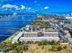 Stunning aerial view showcasing the intercoastal waterway, bridge, and a residential community with a pool at 144 S Halifax Ave # 86, Daytona Beach, FL 32118