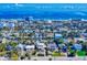 Aerial view of a charming coastal community, with colorful houses, mature trees, and close proximity to the beach at 144 S Halifax Ave # 86, Daytona Beach, FL 32118