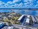Stunning aerial view of waterfront condos with ample parking near a bridge and scenic water views at 144 S Halifax Ave # 86, Daytona Beach, FL 32118