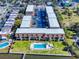 Aerial shot of apartments with a community pool, ample parking, and close proximity to the intercoastal waterway at 144 S Halifax Ave # 86, Daytona Beach, FL 32118
