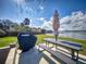Outdoor kitchen in backyard offers relaxing seating and a grill area with a view of the tranquil river at 144 S Halifax Ave # 86, Daytona Beach, FL 32118