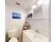 Bright bathroom featuring a white vanity, decorative nautical decor, and ample lighting at 144 S Halifax Ave # 86, Daytona Beach, FL 32118