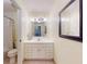 Well-lit bathroom with a white vanity, a large mirror, and a shower-tub combination at 144 S Halifax Ave # 86, Daytona Beach, FL 32118