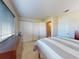 Spacious bedroom with carpet, multiple closets, and a large window for natural light at 144 S Halifax Ave # 86, Daytona Beach, FL 32118