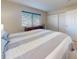 Bright bedroom featuring large windows, a queen bed, and a closet at 144 S Halifax Ave # 86, Daytona Beach, FL 32118