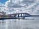 Scenic view of bridge over the water in a tranquil setting with cityscape in the distance at 144 S Halifax Ave # 86, Daytona Beach, FL 32118