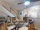 Dining room featuring a glass table, wicker chairs, access to study area and access to kitchen at 144 S Halifax Ave # 86, Daytona Beach, FL 32118