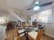 Dining room featuring a glass table, wicker chairs, access to study area and access to kitchen at 144 S Halifax Ave # 86, Daytona Beach, FL 32118