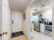 Inviting entryway with tiled floors leads to a modern kitchen featuring stainless steel appliances at 144 S Halifax Ave # 86, Daytona Beach, FL 32118