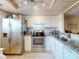 Modern kitchen with stainless steel appliances, granite countertops, and a bright, open design at 144 S Halifax Ave # 86, Daytona Beach, FL 32118