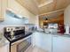 Modern kitchen featuring stainless steel appliances, granite counters, and convenient layout at 144 S Halifax Ave # 86, Daytona Beach, FL 32118