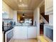 Bright kitchen area featuring a dishwasher, and an open view of the living room at 144 S Halifax Ave # 86, Daytona Beach, FL 32118