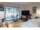 Living room with large sliding glass doors to the patio offering lots of natural light at 144 S Halifax Ave # 86, Daytona Beach, FL 32118