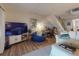 Cozy living space featuring comfortable furniture, a modern entertainment center, and a staircase at 144 S Halifax Ave # 86, Daytona Beach, FL 32118