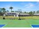 This community features a well-maintained basketball court surrounded by a fence and residences at 160 Limewood Pl # 1, Ormond Beach, FL 32174