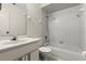 This bathroom features white fixtures, a tiled shower-tub, and a large mirror at 160 Limewood Pl # 1, Ormond Beach, FL 32174