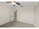 This bedroom features carpeted floors, a ceiling fan, and a doorway to another room at 160 Limewood Pl # 1, Ormond Beach, FL 32174