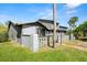 Comfortable residence featuring a side yard, fresh green grass, and a serene environment at 160 Limewood Pl # 1, Ormond Beach, FL 32174