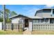 Charming condo featuring a fenced front yard and well-maintained landscaping and front entry at 160 Limewood Pl # 1, Ormond Beach, FL 32174